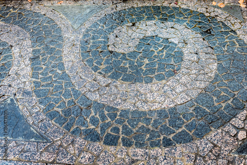 A closeup of a colorful sidewalk paver design at Grey Towers National Historic Site in Milford, Pennsylvania