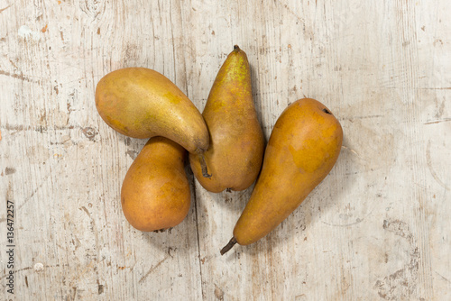 Five Pears on a Wooden Background