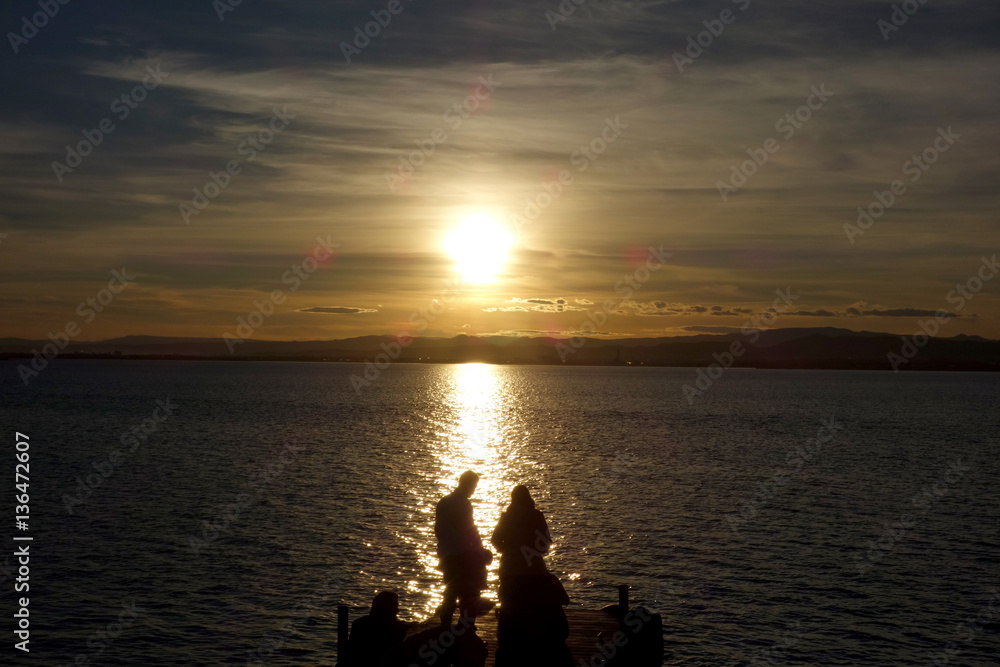 couple at a sunset in the Albufera lake, in Valencia