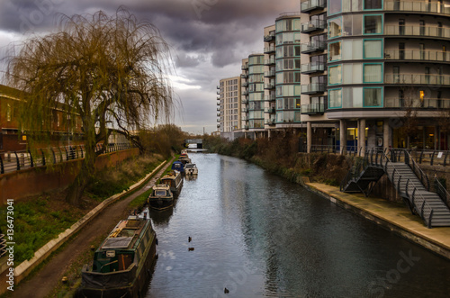 old barges along the canal on a cloudy day photo