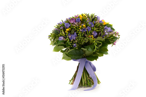 purple and yellow crocus bouquet tied  ribbon on a white background. Valentine's Day