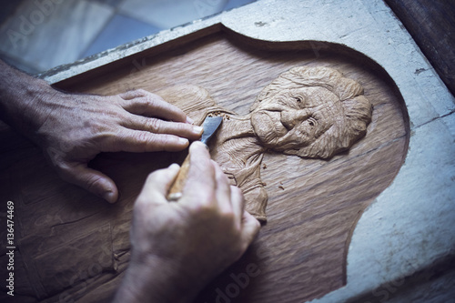 Cropped image of man carving in workshop