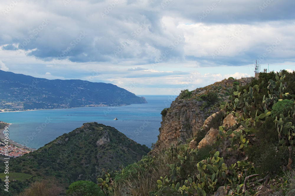 Beautiful mountain landscape. Huge colony of cactuses settled on the mountain slope. Tindari. Sicily Beautiful mountain landscape. Huge colony of cactuses settled on the mountain slope. Tindari. Sicily