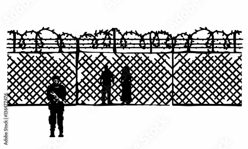 Fence with barbed wire to prevent illegal immigration. Isolated.