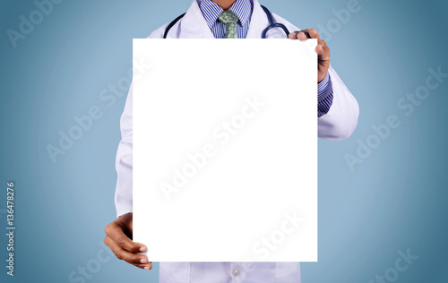 Doctor holding card with stethoscope isolated on color backgroun