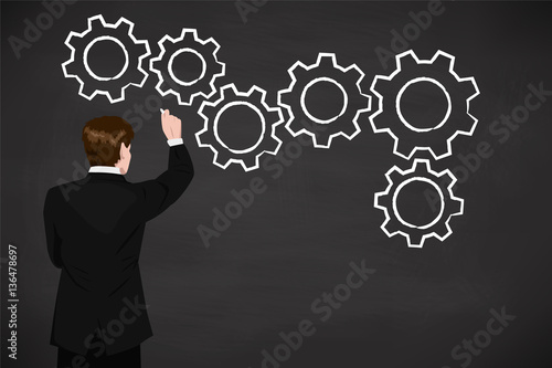 business concept - man draws gears