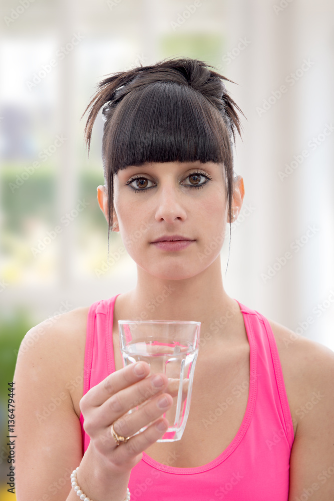 young woman drinks glass of water young woman drinks glass of water