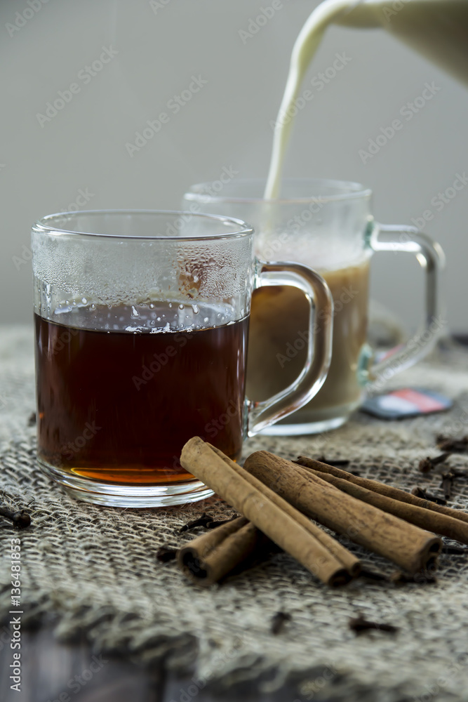 Masala tea with milk and spices - cinnamon, cloves, pepper, cardamom and ginger Masala tea with milk and spices - cinnamon, cloves, pepper, cardamom and ginger