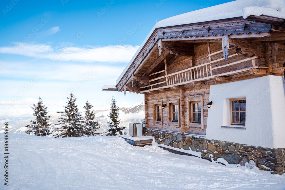 Wooden villa in the snow and snowy white trees in the background Wooden villa in the snow and snowy white trees in the background