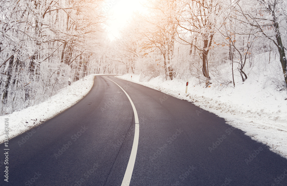 Empty road in forest in winter Empty road in forest in winter