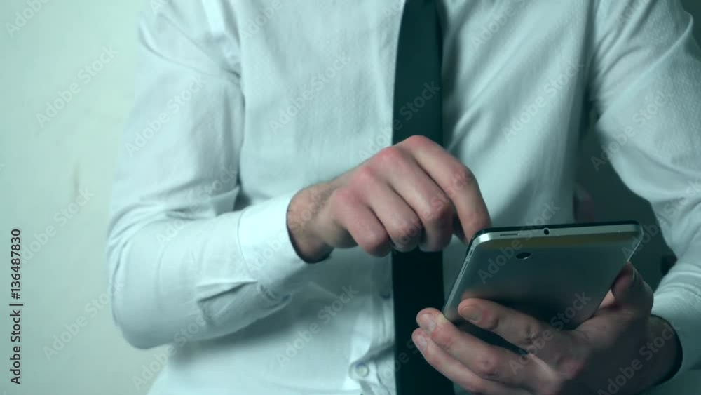Businessman working on a tablet PC Businessman working on a tablet PC