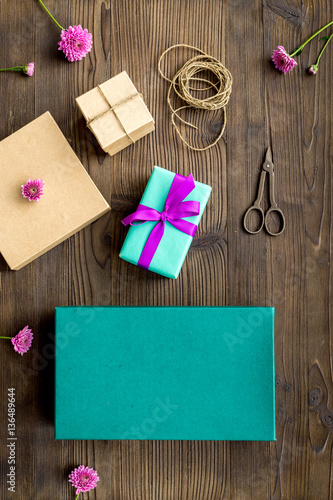 wrapping gifts in box for holiday top view mock up