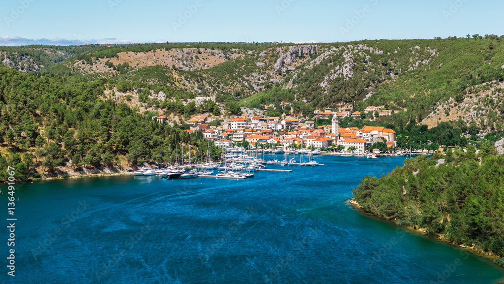 Town of Skradin on Krka river in Dalmatia, Croatia viewed from distance. Skradin is a small historic town and harbour