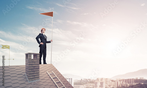 Young businessman with flag presenting concept of leadership. Mi © adam121