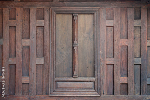 thai style window on wooden wall