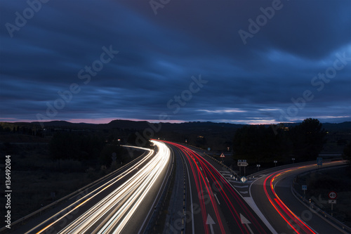 Night View of Highway Traffic and Cloudy Sky
