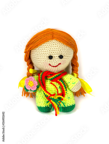 Knitted doll girl with long red hair.