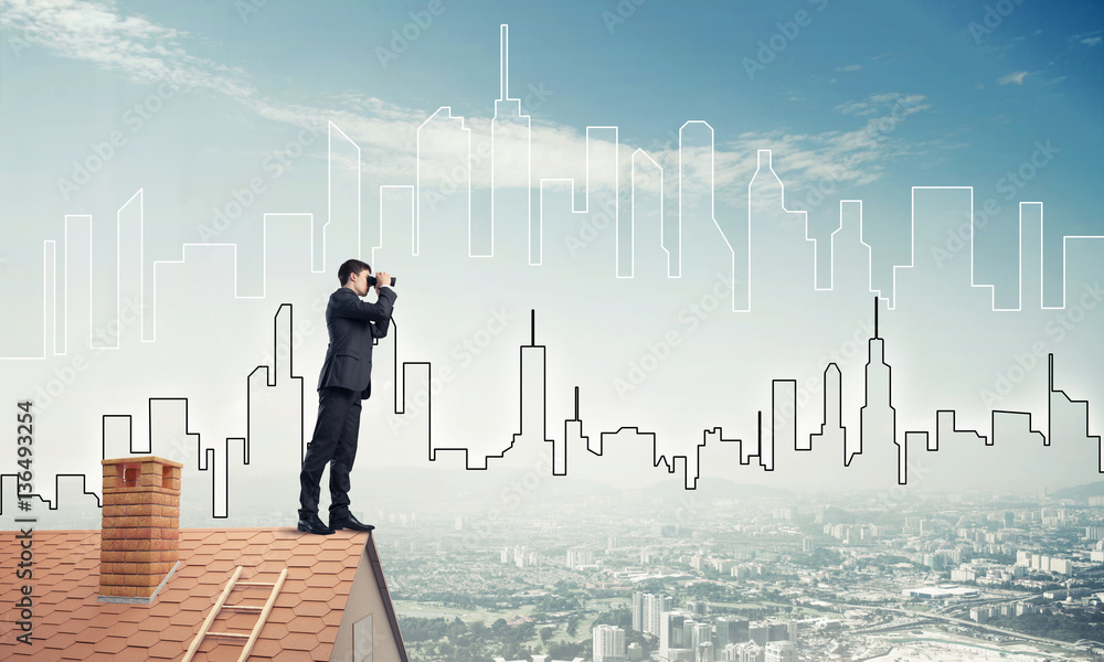 Businessman standing on roof and looking in binoculars. Mixed me Businessman standing on roof and looking in binoculars. Mixed me