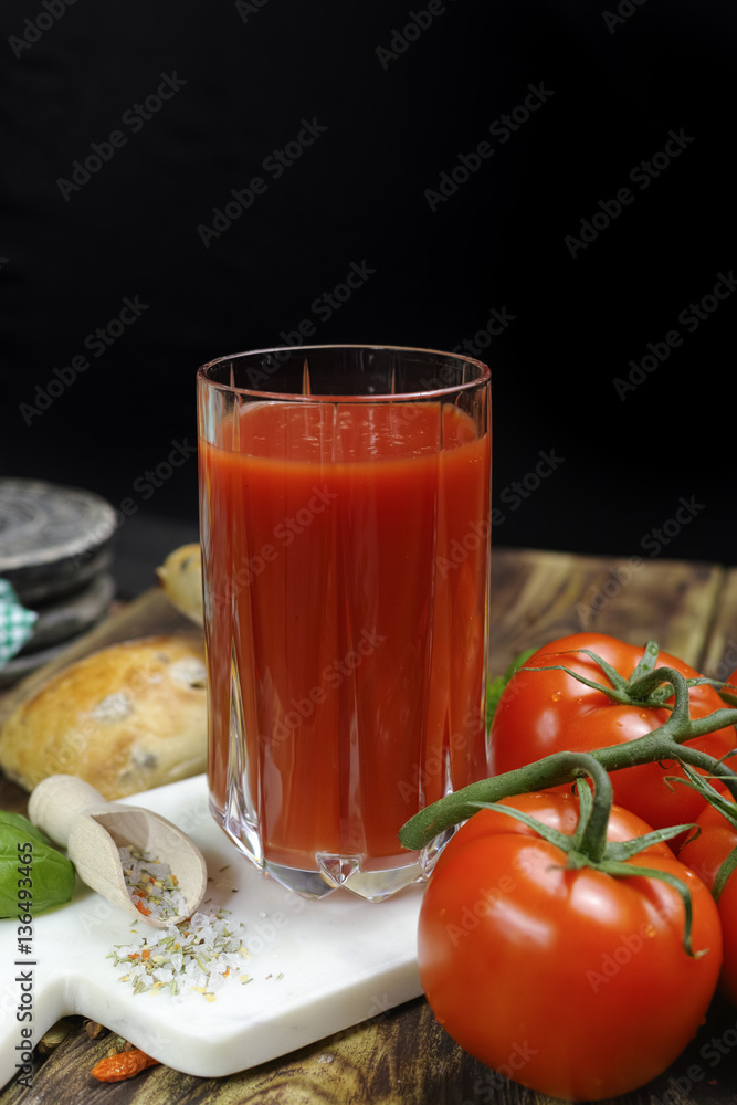 Raw Organic red Tomato Juice with salt, basil and bread Raw Organic red Tomato Juice with salt, basil and bread