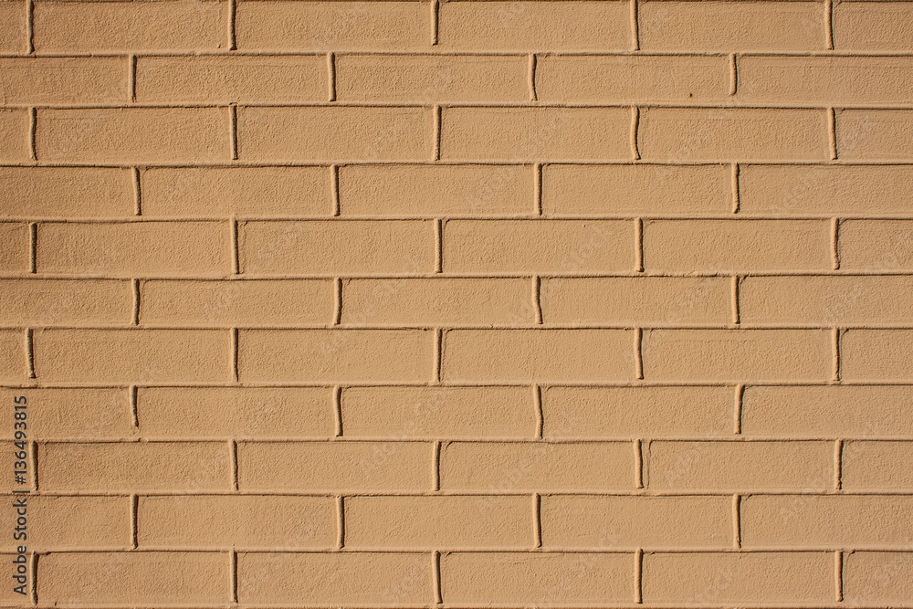 Obraz premium Texture, background. Imitation brick on beige plaster with raise