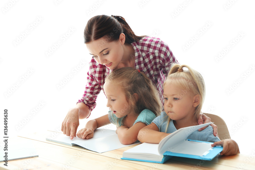 Mother with daughters doing homework