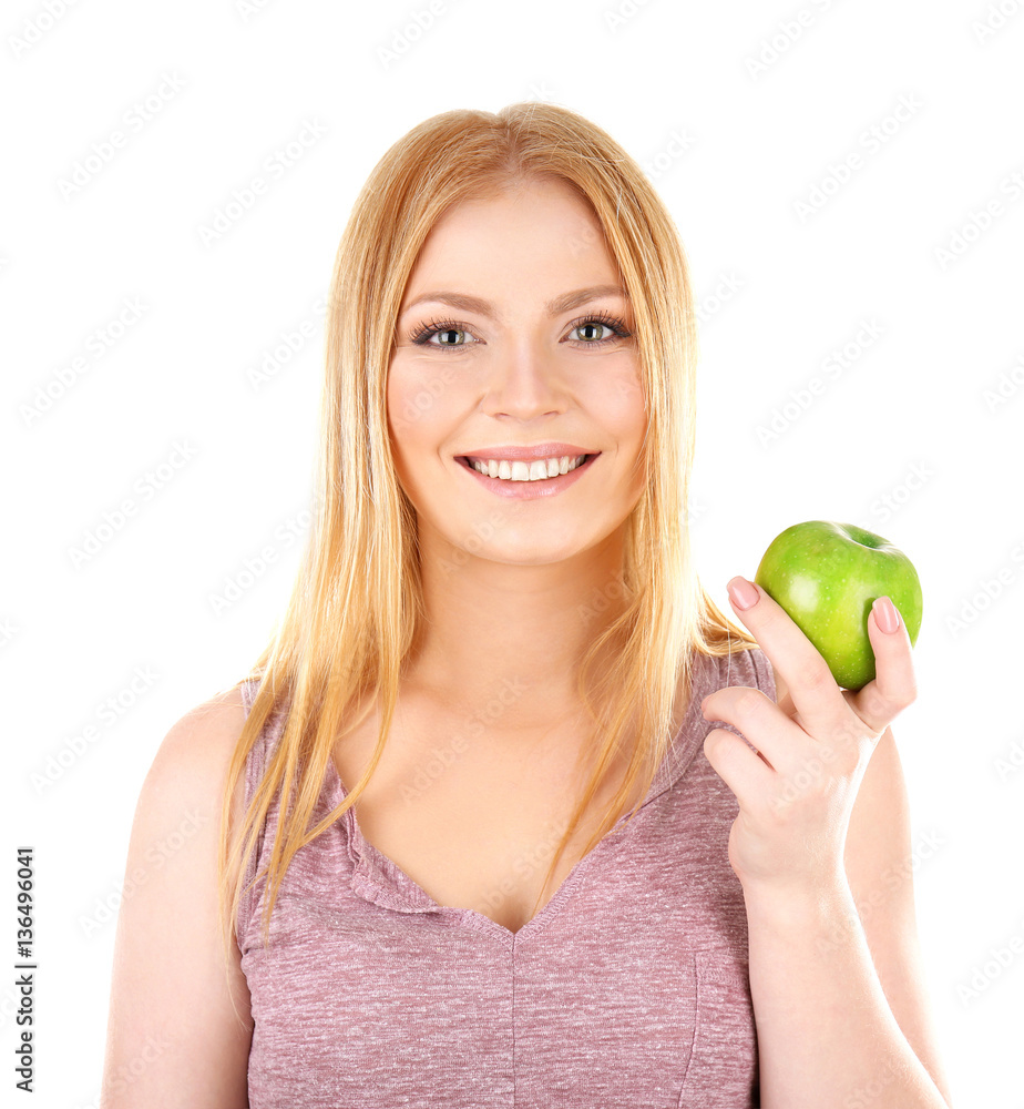 Young woman holding apple on white background