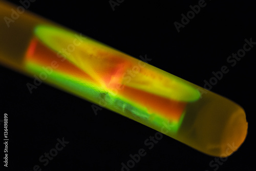 Two liquids mix after breaking the glass capillary in a chemiluminescent bracelet photo