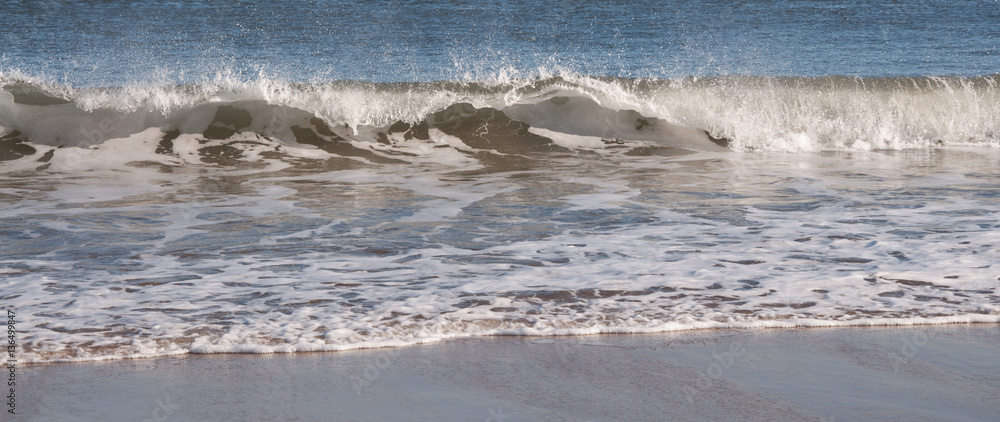 Waves Crashing on Shore with Foam at Plum Island