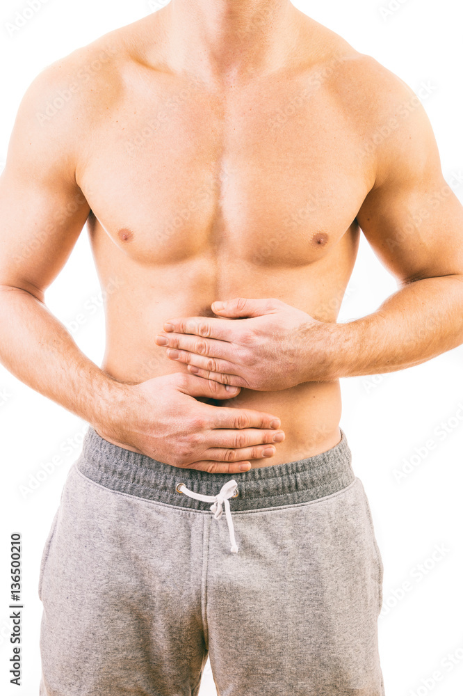 Naklejka premium Man with stomach pain over white background