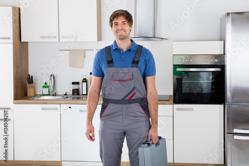 Happy Young Worker Holding Toolbox