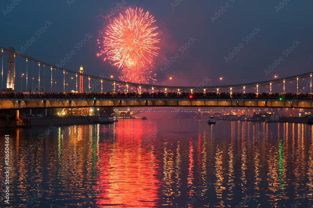 Fireworks in Moscow on the river with crowd of people watching