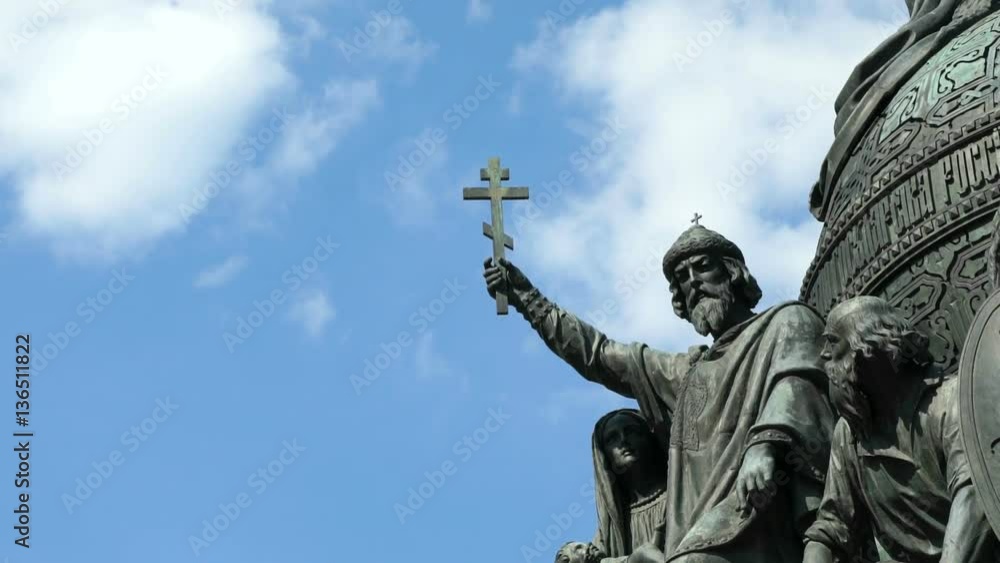Grand Prince of Kiev Vladimir Svyatoslavich in the center of the composition with a raised eight-pointed cross of the monument Millennium of Russia in Veliky Novgorod, Russia Grand Prince of Kiev Vladimir Svyatoslavich in the center of the composition with a raised eight-pointed cross of the monument Millennium of Russia in Veliky Novgorod, Russia