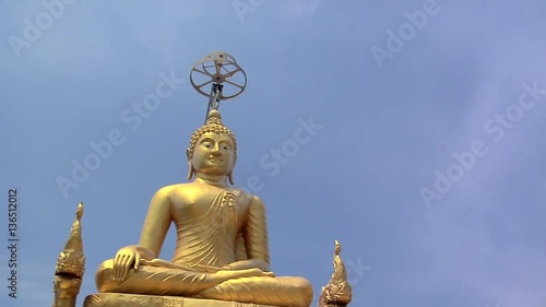 Golden Buddha besides the Big Buddha Statue at Wat Phrathong photo