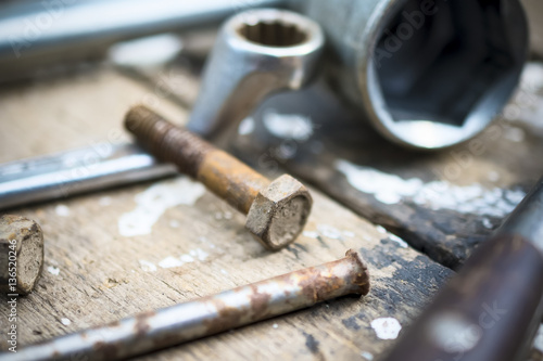 Old  oiled wheel hub lies on a wooden table