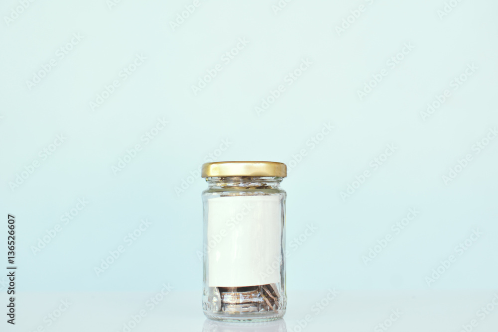 Close up coin in glass jar ,concept save monClose up coin in glass Close up coin in glass jar ,concept save monClose up coin in glass