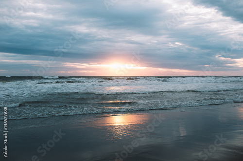 Colorful sunset on the beach of Indian ocean  Indonesia  Bali