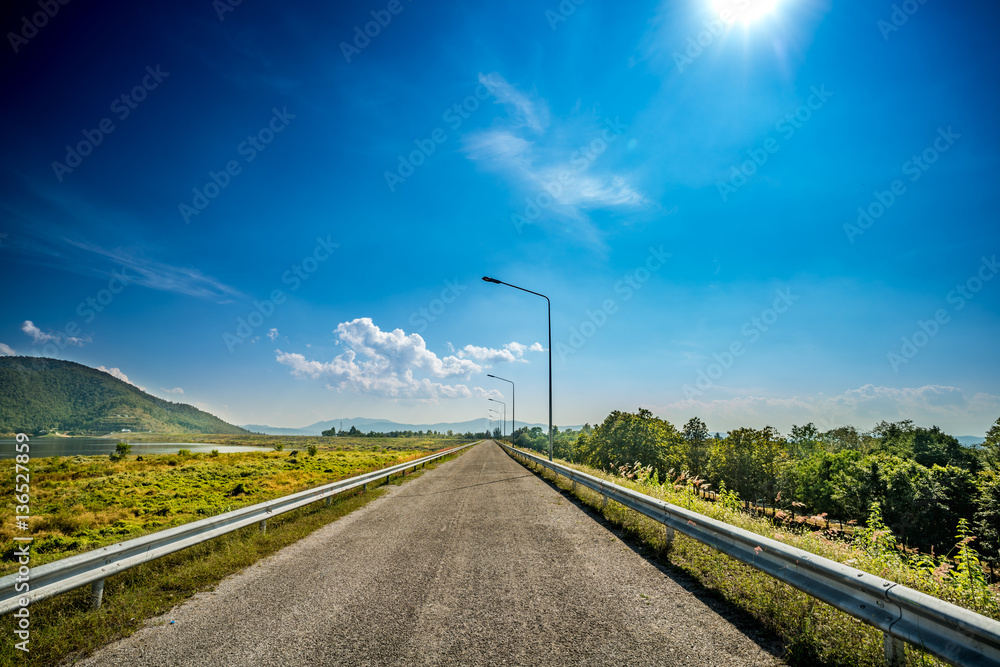 Country road with blue sky