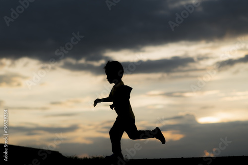 Wallpaper Mural silhouette A kid run at sunset Torontodigital.ca
