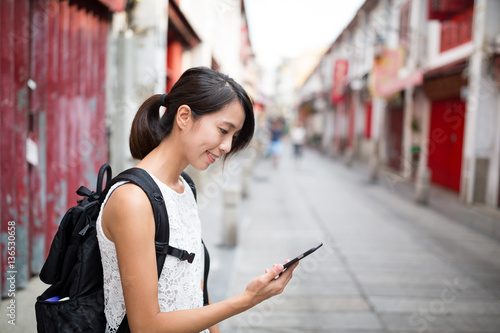 Woman using cellphone in Macao