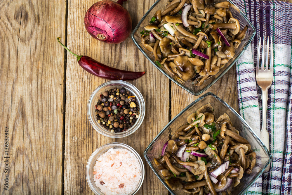 Marinated mushrooms and onions in a glass salad bowl Marinated mushrooms and onions in a glass salad bowl