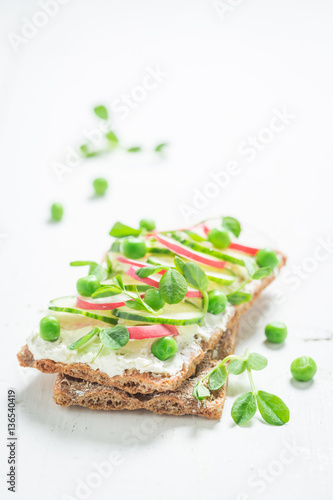 Healthy crispy bread with crunchy bread, fromage cheese and avocado