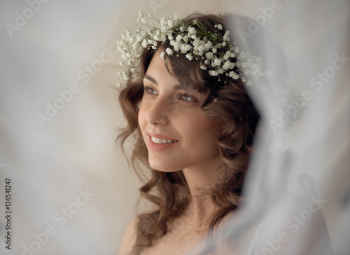 Sensual smiling woman in wreath