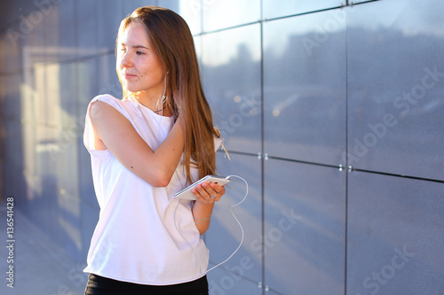 One young adult pretty girl student business woman holds telepho photo