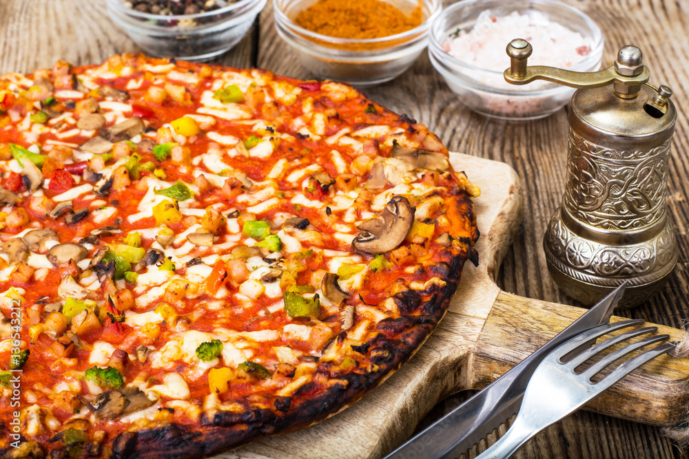Vegetarian pizza with tomatoes and mushrooms Vegetarian pizza with tomatoes and mushrooms