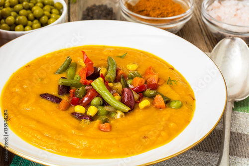 Spicy vegetable cream soup with vegetables