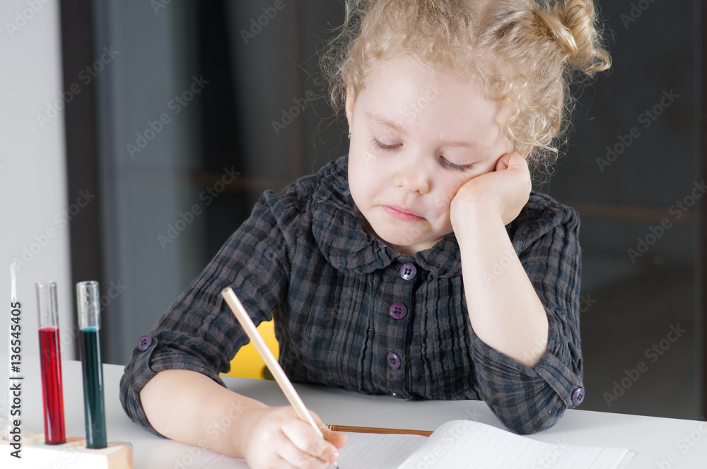 Caucasian child spends chemical experiences in class room Caucasian child spends chemical experiences in class room