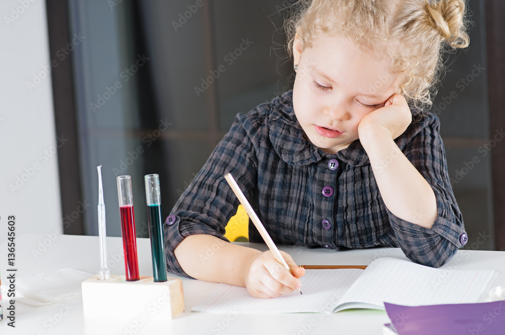 Caucasian child spends chemical experiences in class room Caucasian child spends chemical experiences in class room
