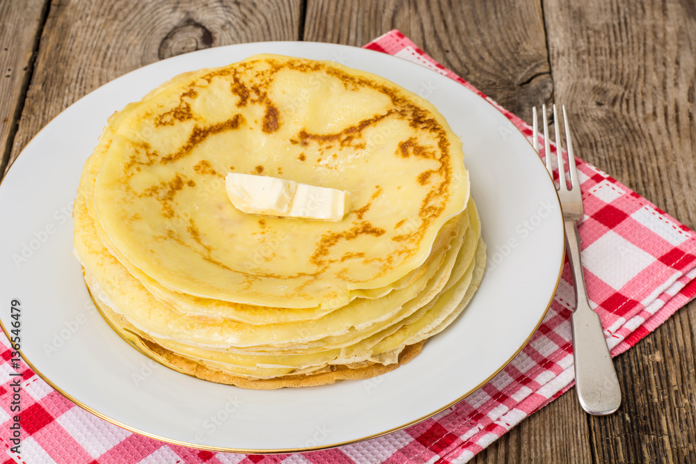Thin pancakes with butter Thin pancakes with butter