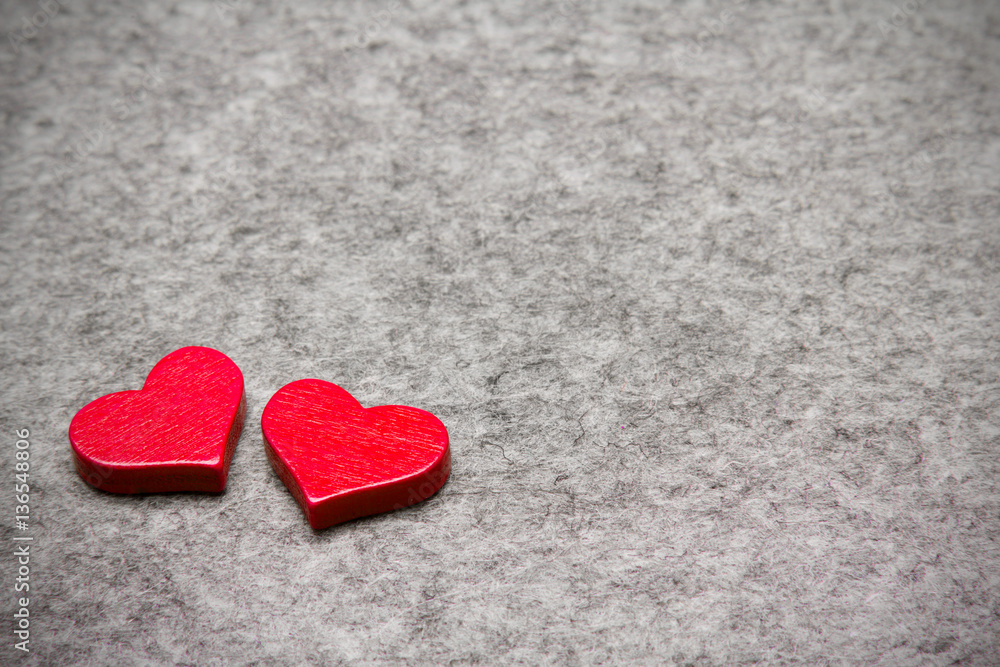 Wooden red hearts on gray felt background, copy space Wooden red hearts on gray felt background, copy space