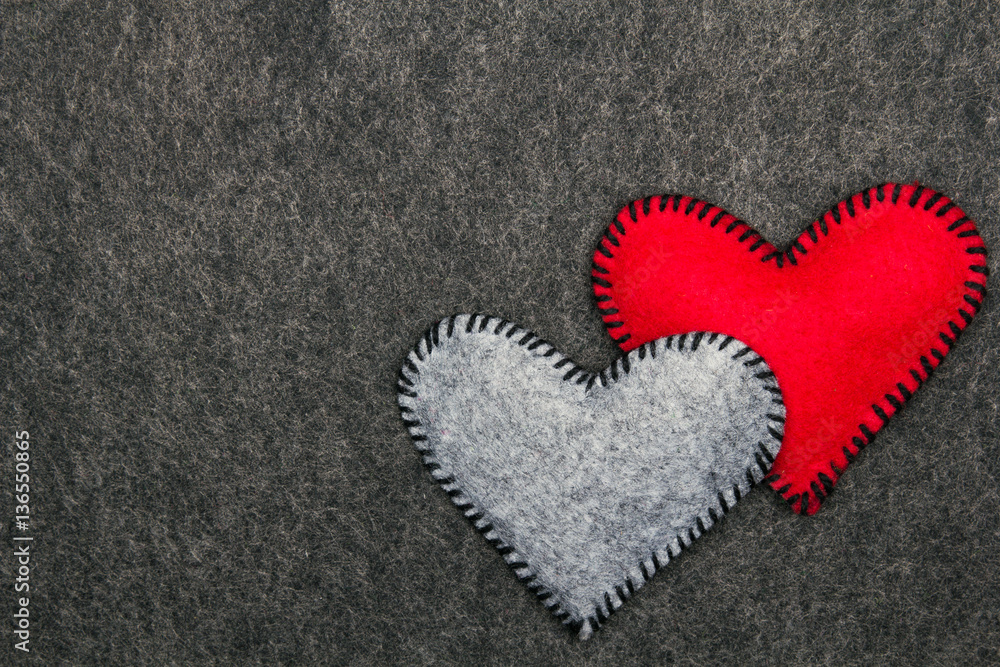 Felt hearts on gray background, copy space Felt hearts on gray background, copy space